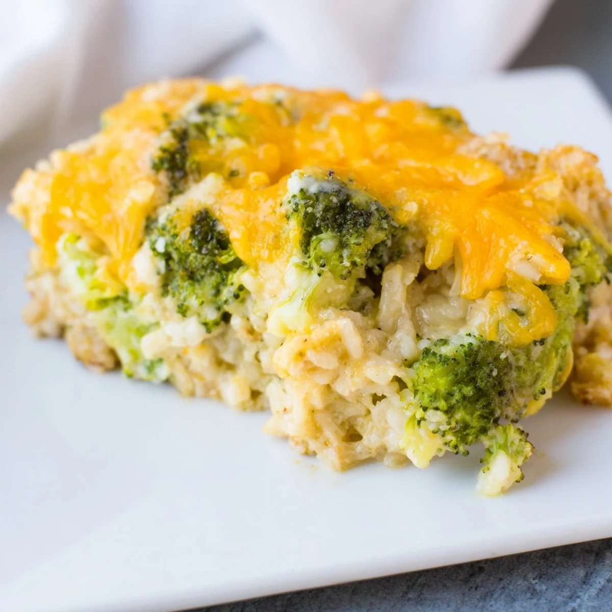Golden and bubbly Cheesy Broccoli and Rice All-in-One Bake, fresh from the oven, offering a comforting aroma.