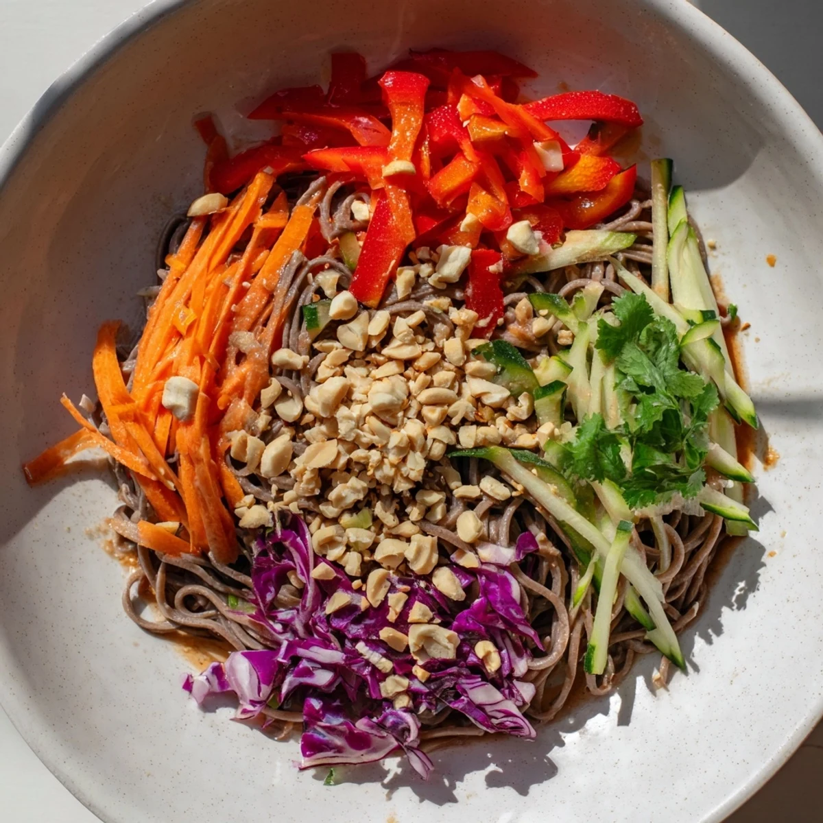 Beautiful bowl of Cold Noodle Salad with peanuts, ready to enjoy as a light, flavorful meal.