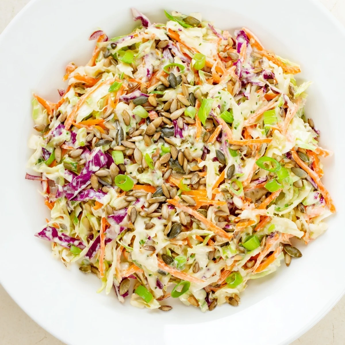 Fresh, crunchy coleslaw salad, a colorful mix of shredded cabbage and carrots ready to serve.