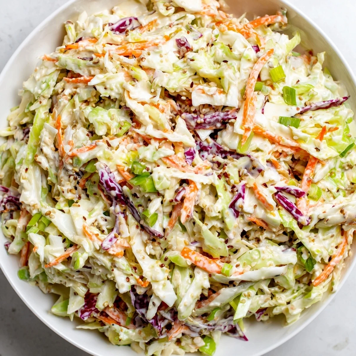 This vibrant coleslaw salad image shows a satisfying crunch alongside a creamy, tangy dressing.