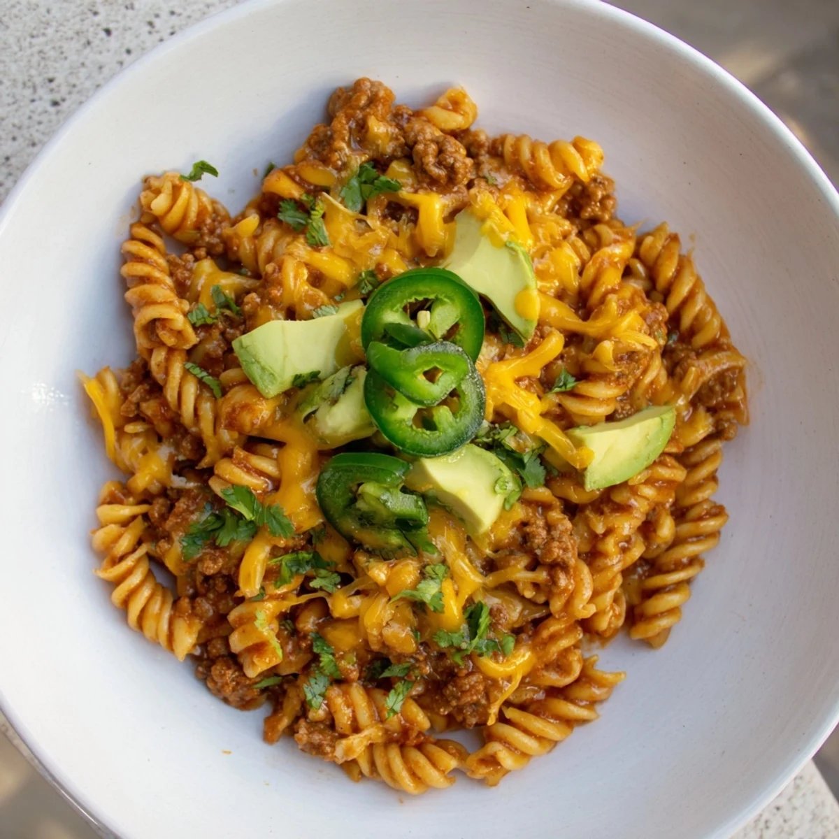 Family-style, delicious beef taco pasta skillet, perfect for a quick, flavorful weeknight meal.