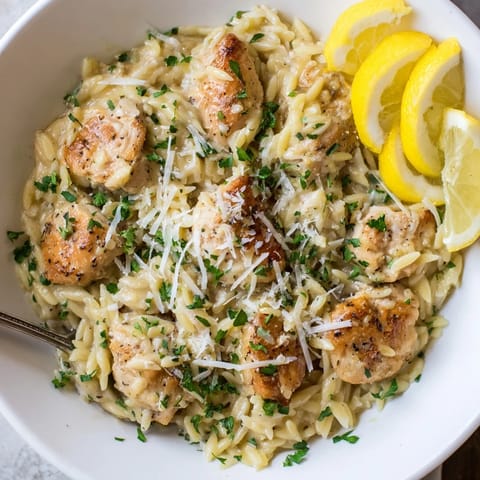 A skillet filled with Creamy Lemon Chicken Orzo, promising a comforting one-pan, Mediterranean-inspired dinner.