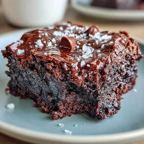 Homemade brownies with sourdough discard and a sprinkle of sea salt flakes, delivering deep chocolate flavor and a perfectly chewy, moist crumb.  
