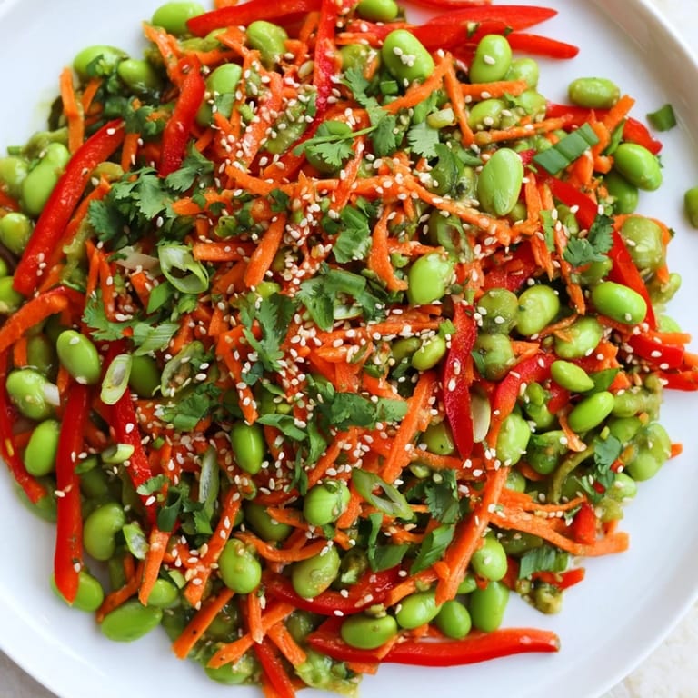 Savory Asian Edamame Salad with tender edamame, and a delicious homemade sesame ginger dressing, ready to enjoy.