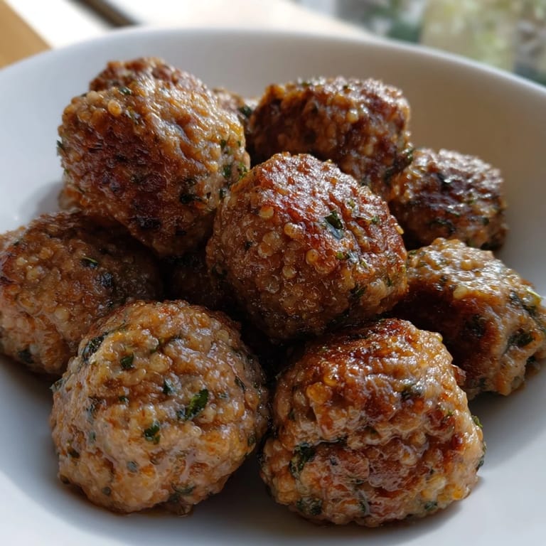 A plate of sizzling Turkish Köfte, aromatic with herbs, promising a delicious and flavorful meal.