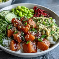 Vibrant Salmon Poke Bowl with creamy avocado and crisp edamame, ready to eat.